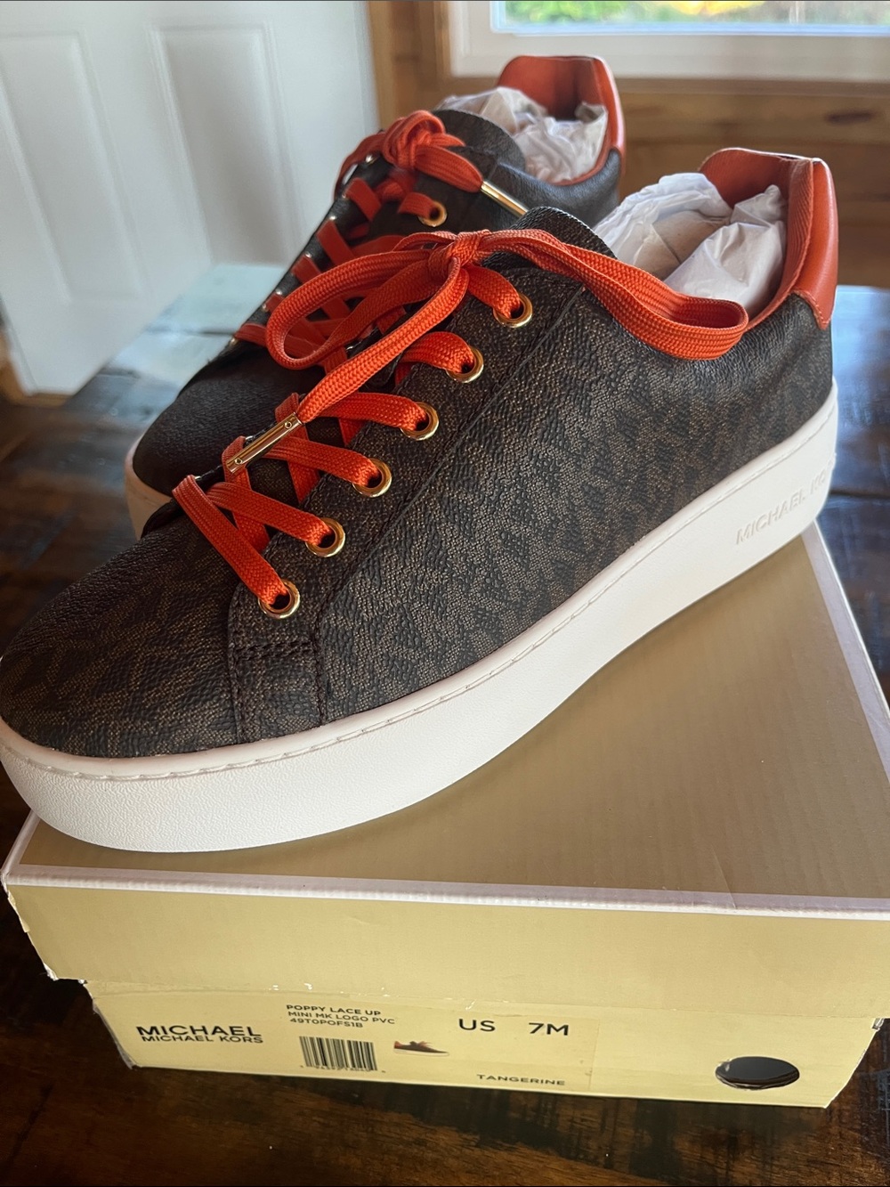 Michael Kors Woman’s Brown MK Monogram Sneaker with Orange Accents